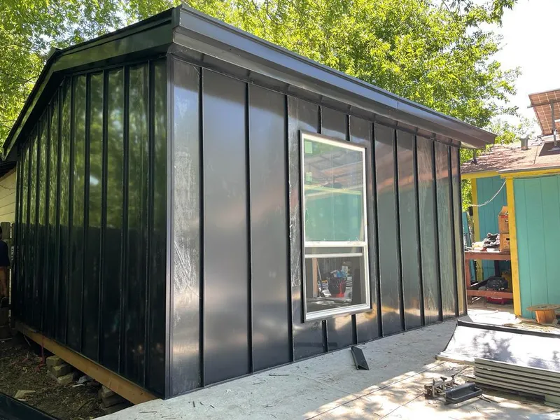 Black standing seam metal wall panels for Roof Inspection in Rusk